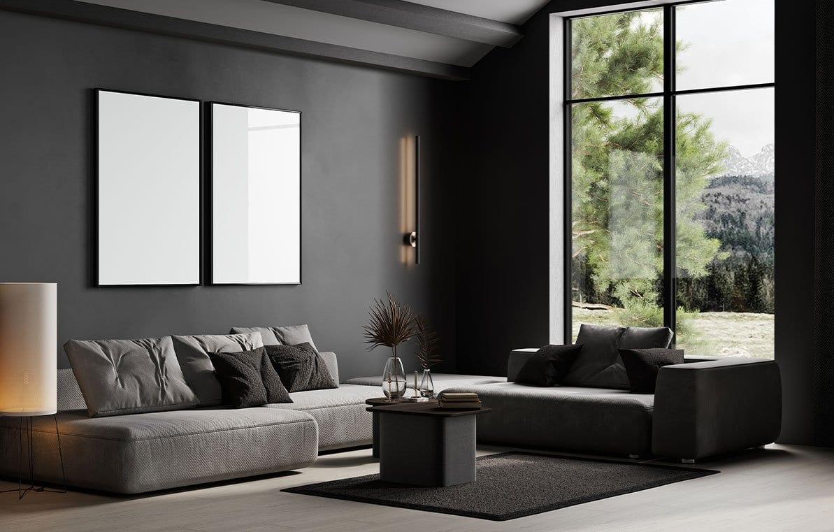 Moody living room with charcoal walls and grey sofas